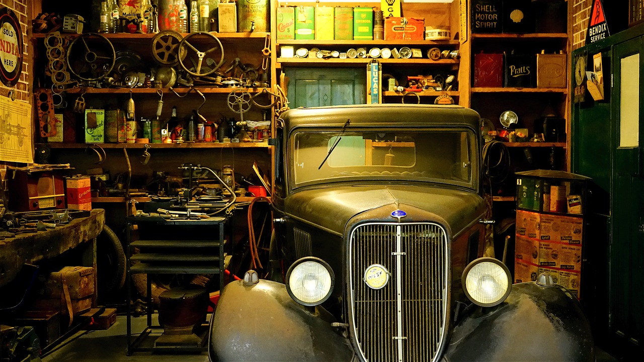 Classic car inside a traditional motor workshop