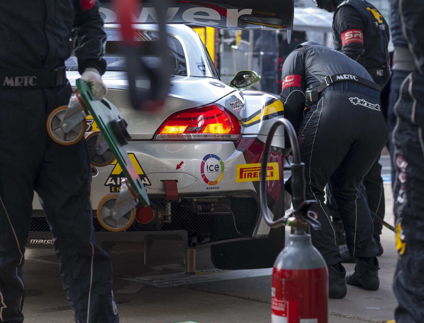 Pit crew working on a competition car