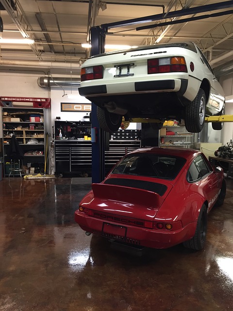 Cars raised on a workshop lift for inspection