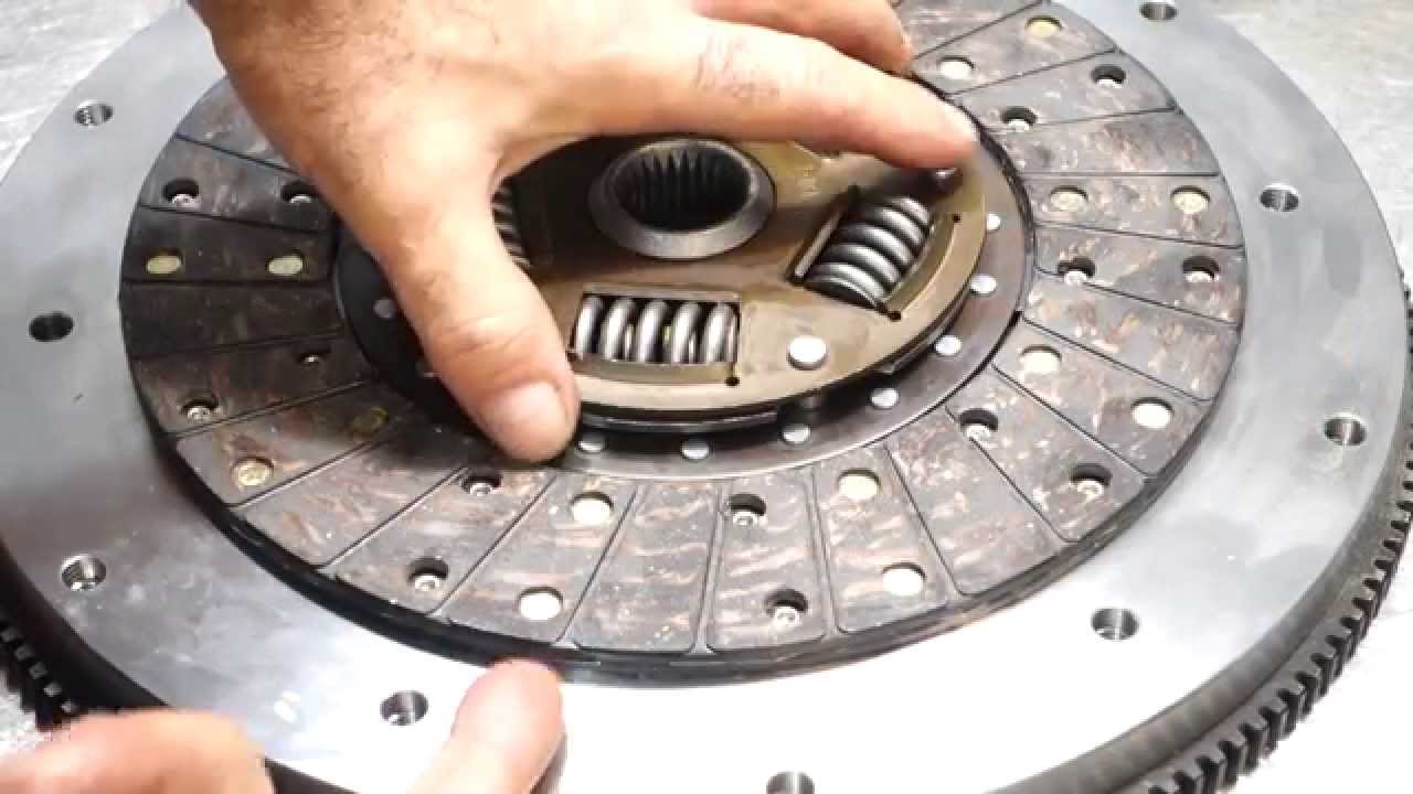 Clutch disc being inspected by hand